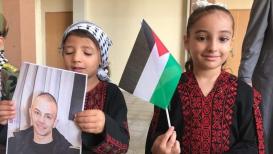 أطفال مدرسة الأمل في المحافظة الوسطى بقطاع غزة ينظمون وقفة حداد على روح الشهيد عدي التميمي